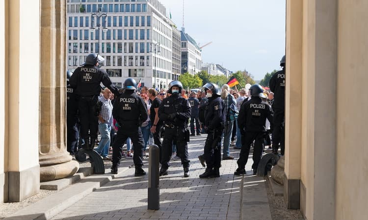 Berlin police break up weekend protest and open arson investigation