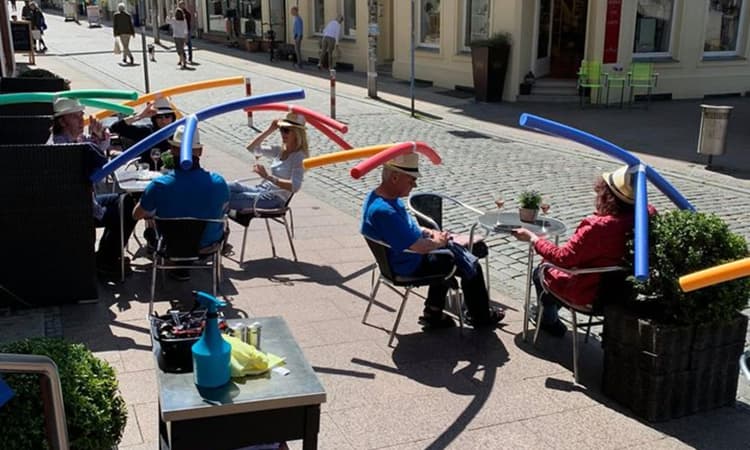 Cafe in Schwerin enforces social distancing with swim noodle hats