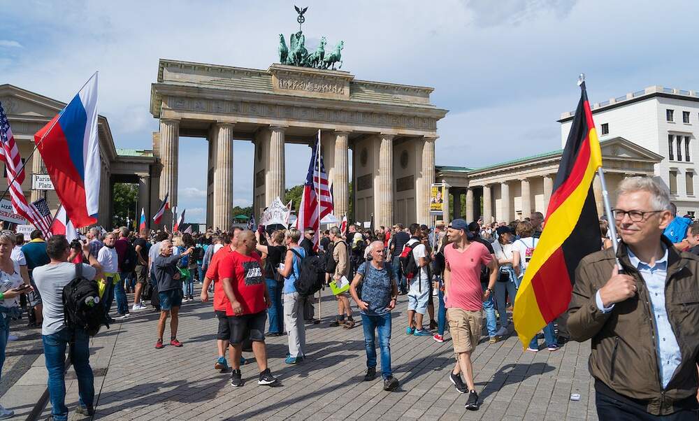 Crowd Gathers At Brandenburg Gate To Protest Coronavirus Measures